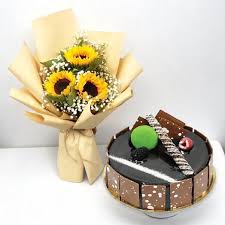 A bouquet of sunflowers paired with chocolate truffle cake
