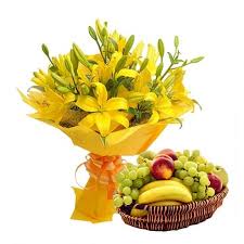A bouquet of yellow lilies and nutritious, in-season fruits
