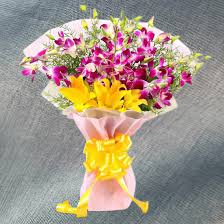 A bouquet of yellow lilies and purple orchids