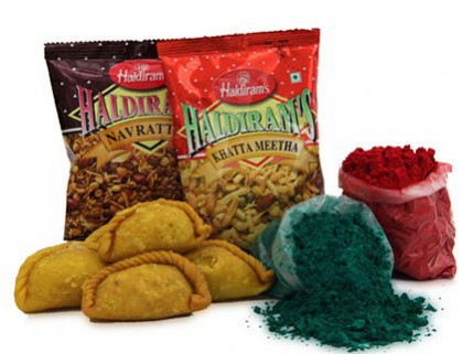 A gift basket with both sweet and crunchy items for Holi
