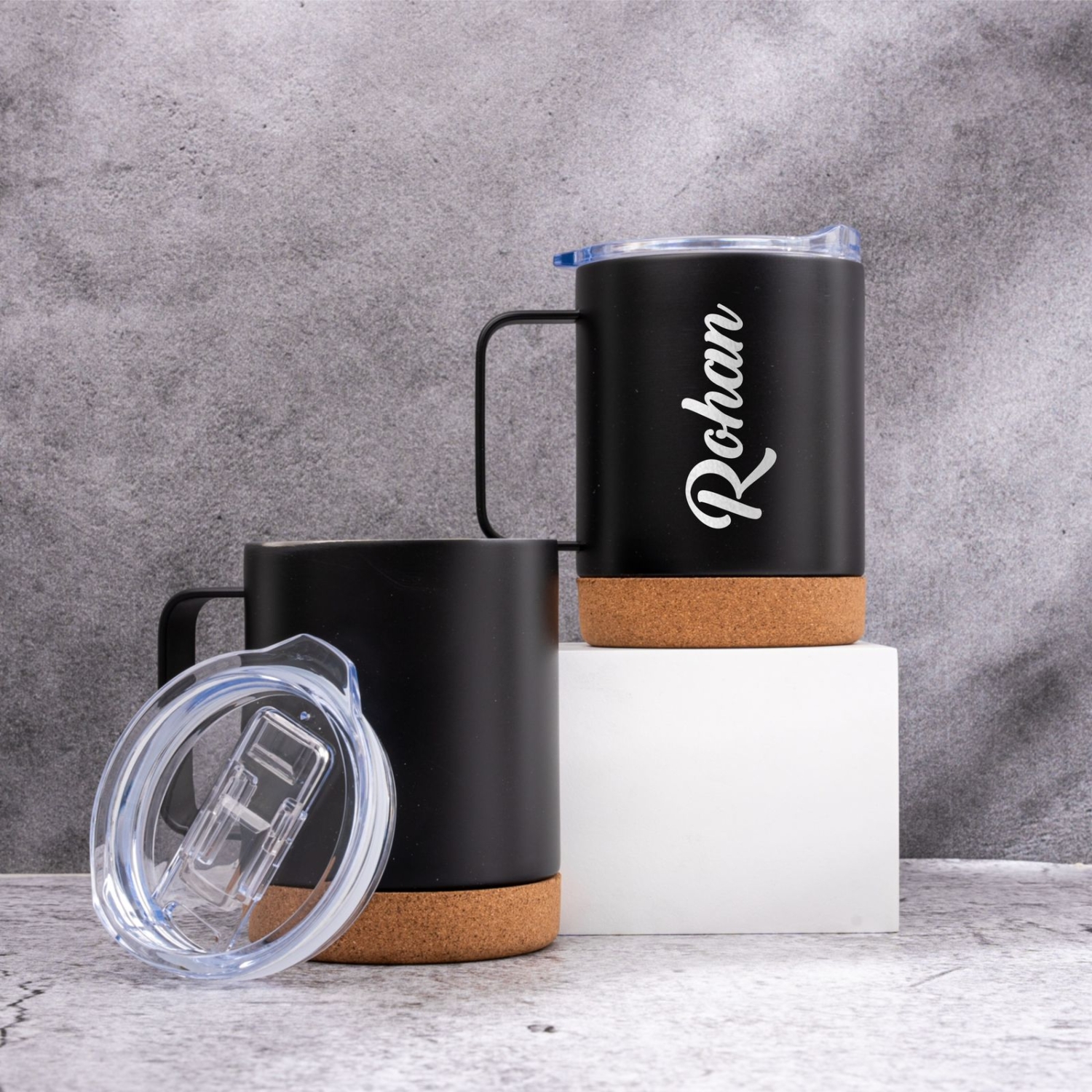 A set of personalised stainless steel coffee mugs for couples