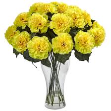 A vase filled with yellow carnations