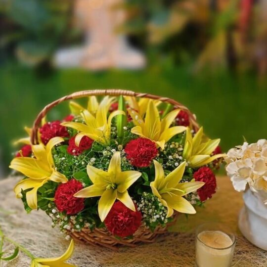 Basket Arrangement of Red Carnations and Yellow Lilies