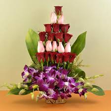 Basket arrangement with exotic orchids and roses