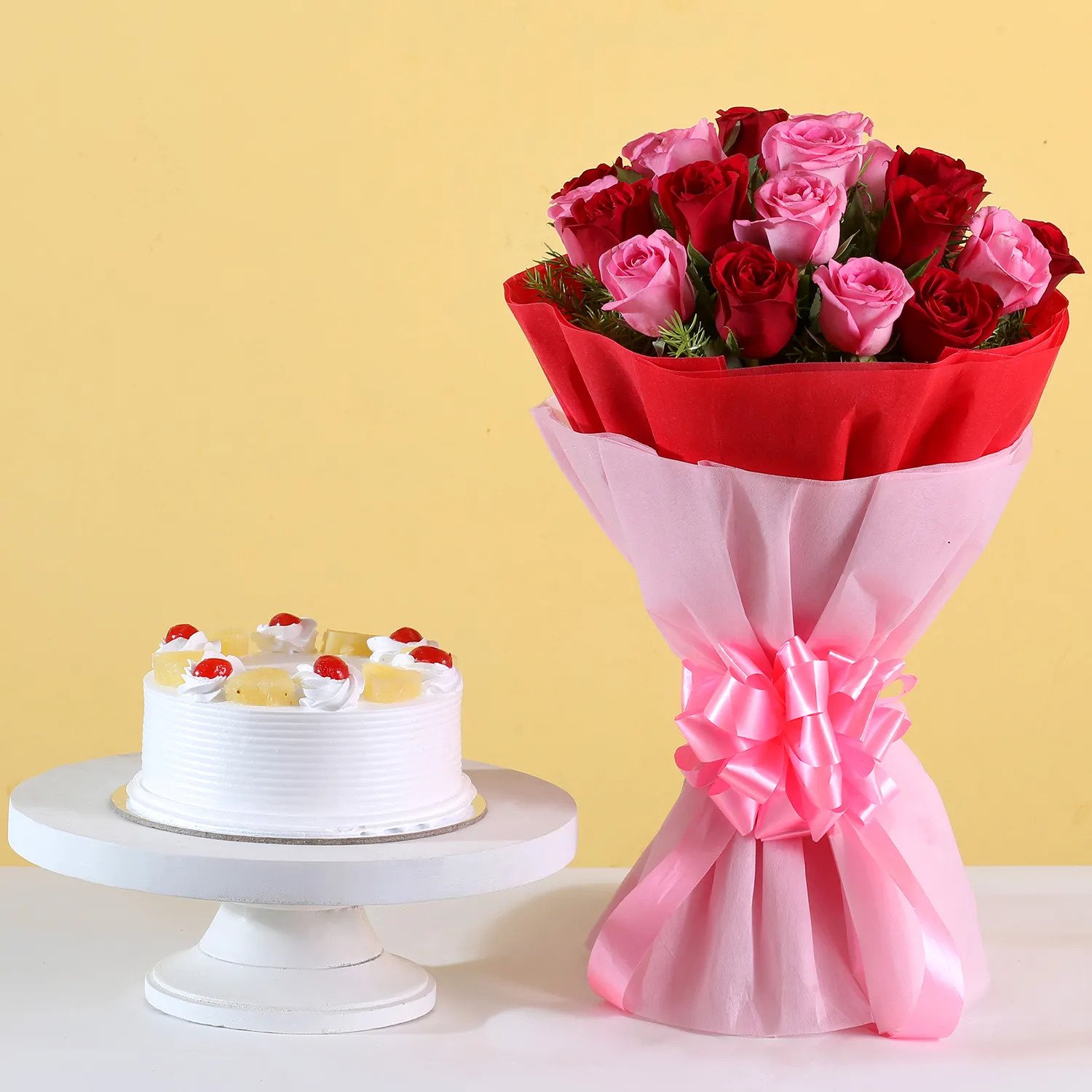 Beautiful bouquet of pink and red roses paired with pineapple cake