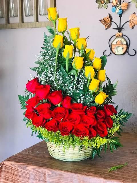Colourful red and yellow roses united in a basket