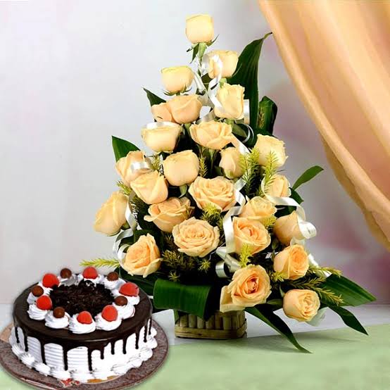 Delicious Black Forest cake with Peach Colored Roses Basket arrangement.