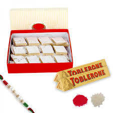 Delicious Kaju Katli paired with exquisite Rakhi and Toblerone Chocolate
