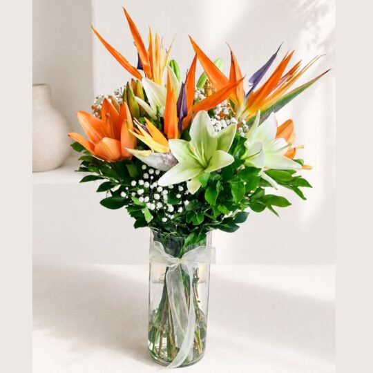 Distinguished White Lilies with Stylish Bird of Paradise Vase Arrangement