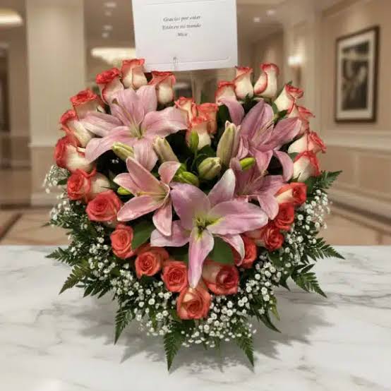 Entrancing Heart Shaped arrangement with Pink Roses and Lilies.