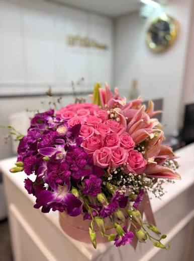 Exclusive Box Arrangement with Purple and Pink Flowers