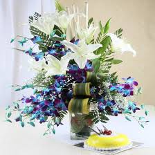 Exclusive White & Blue Floral arrangement with Luscious Pineapple Cake