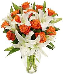 Exotic White Lilies with orange Roses fused in a Vase