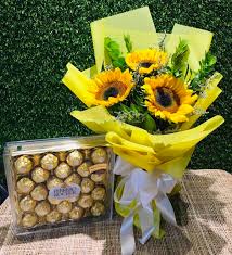 Ferrero Rocher box combined with a bouquet of vibrant sunflowers