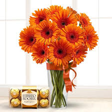 Gorgeous orange gerberas in a vase with Ferrero Rocher
