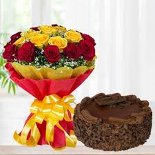 Handtied bouquet of red and yellow roses coupled with chocolate cake.