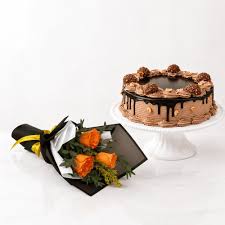 Mouthwatering Ferrero Chocolate Cake with Small Orange Roses Bouquet