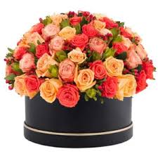 Pink and Peach Roses placed in a black box.