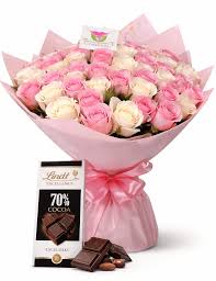 Pink and white rose bouquet paired with Lindt chocolate.