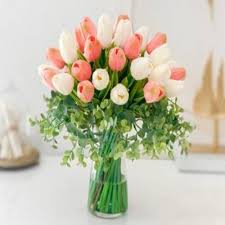 Premium pink and white tulips in vase.