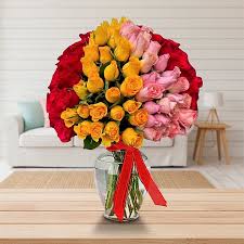 Red, Pink and Yellow Roses arranged in a Vase