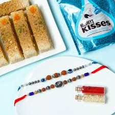 Rudraksha Rakhi Duo Paired with Delicious Milk Cake and Premium Chocolate