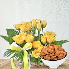 Scintillating Yellow Roses Arrangement with Healthful Almond combo