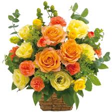 Striking Orange Roses with Yellow Roses decorated in a basket