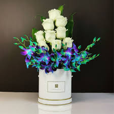Superlative Blue Orchids with White Roses in a Basket