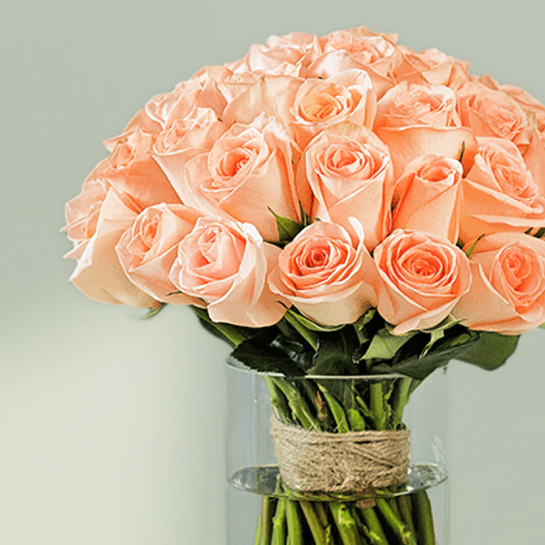 Vase arrangement with Peach Colored Roses