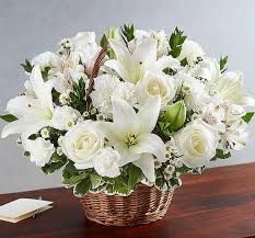 White Lilies, White Roses, and White Carnations merged in a beautiful basket