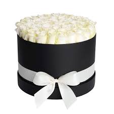 white roses placed in a luxury black box.